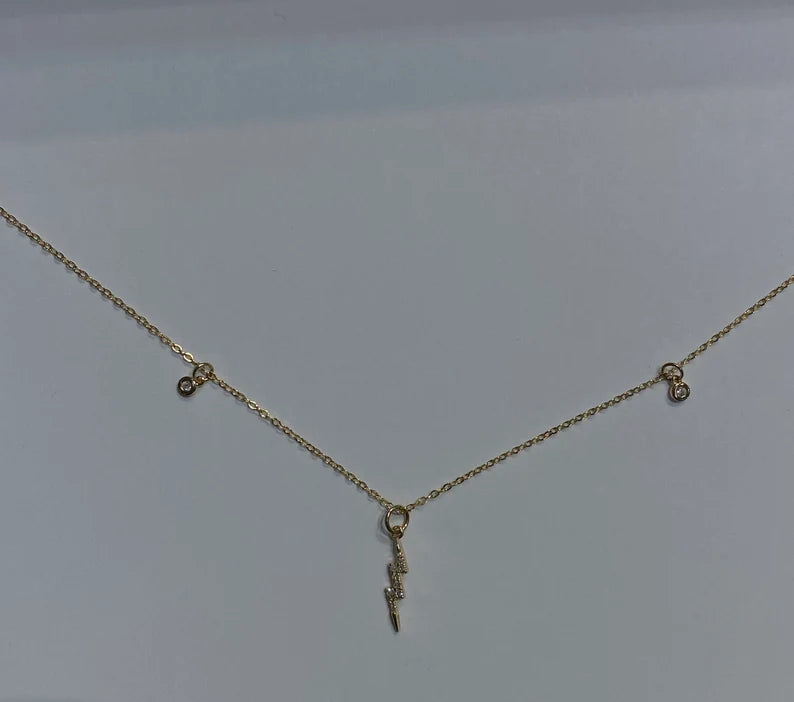 Lighting charm in gold chain